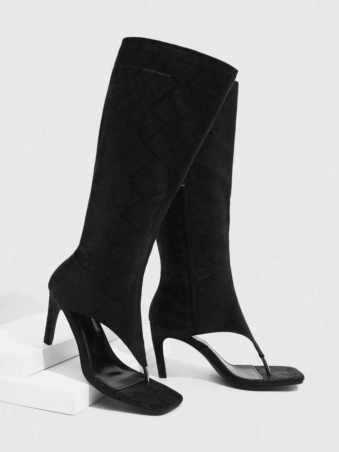 Step into sophistication with these show-stopping tall boots that command attention from every angle. Featuring a chic square toe and sleek slim heel, they're designed for anyone who refuses to blend into the background. Whether you're heading to the office, a night out, or anywhere in between, these boots deliver that perfect blend of edge and elegance. The structured silhouette flatters your legs while the elevated heel adds instant confidence to your stride. Make a bold statement—because ordinary just is