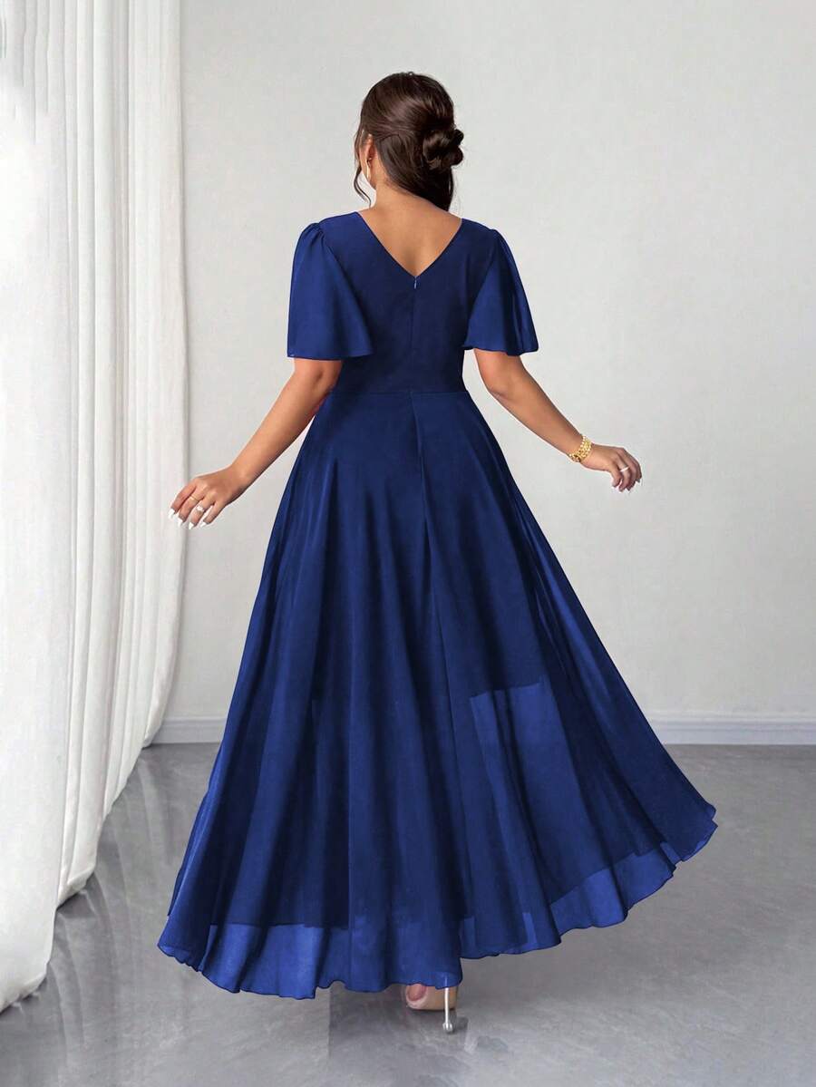Twirl into romance in this stunning plus-size A-line chiffon dress! Delicate ruffle sleeves add a whimsical touch while the flowing silhouette flatters every curve. The lightweight chiffon fabric drapes beautifully, creating an effortlessly elegant look perfect for weddings, date nights, or any special moment worth celebrating. Whether you're dancing under the stars or stealing hearts at a garden party, this dress brings timeless charm with a modern twist. Slip it on and feel absolutely fabulous!