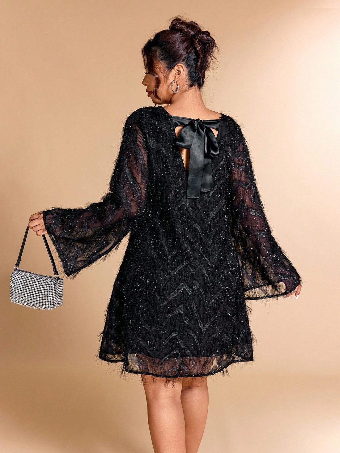 Step out in style and confidence with this Elegant Plus Size Flare Sleeve Dress. Featuring playful flare sleeves and eye-catching fringe details, it brings a fun twist to sophistication. Perfect for turning heads at any event while ensuring a comfortable, flattering fit designed just for you!