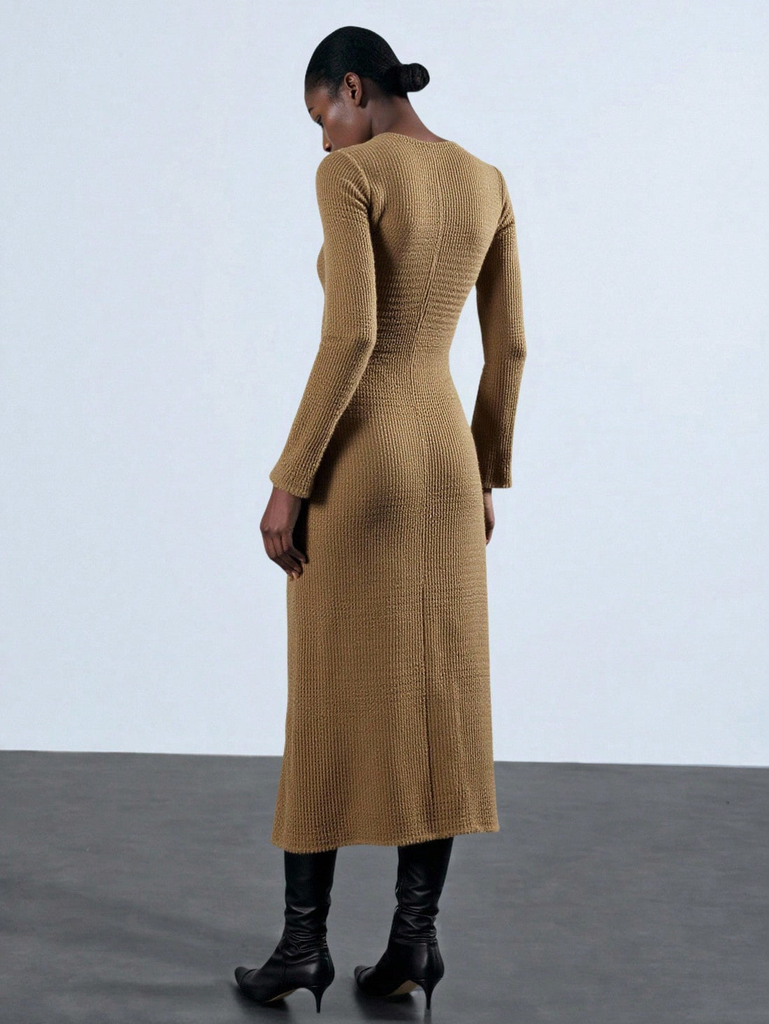 Step into the spotlight with this chic brown leather buckle dress, crafted to catch every eye. Featuring a flattering V-neck and playful pleats, it’s your go-to for New Year’s sparkle or Saudi National Day festivities. Short and stylish, it blends edgy leather with feminine flair—perfect for dancing the night away and making unforgettable memories.