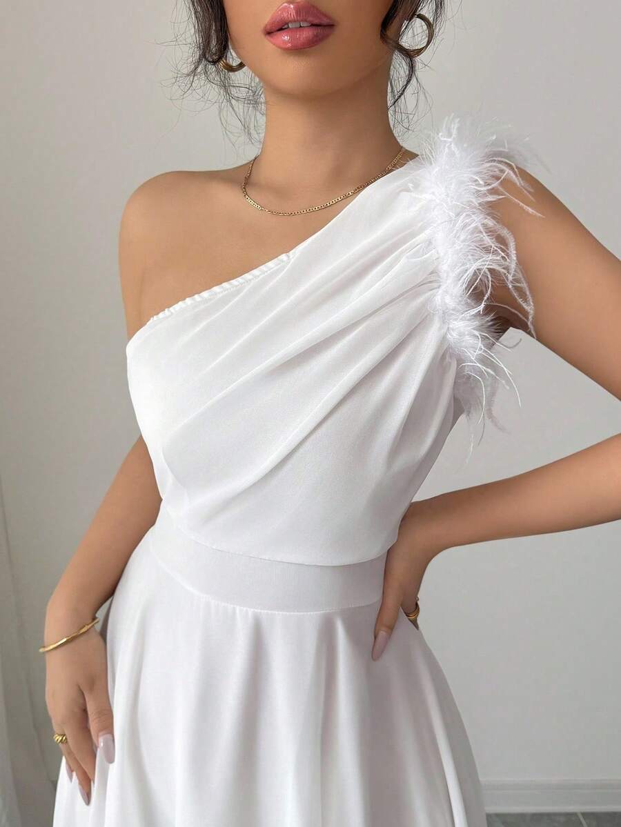 Embrace timeless elegance with this French Romantic sleeveless dress, featuring an enchanting asymmetrical collar that adds sophisticated movement and visual intrigue. The graceful silhouette captures the essence of Parisian style, perfect for special occasions or elevated everyday wear. Crafted with attention to detail, this piece celebrates feminine charm through its unique neckline design and flowing drape. An effortless statement piece that transitions beautifully from day to evening.