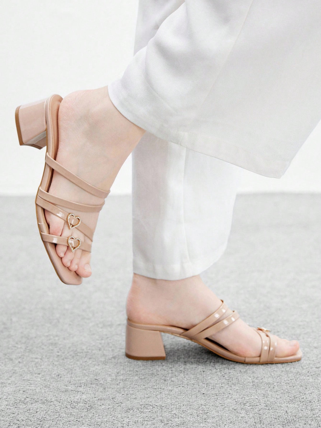 Step into the season with sparkle and sass! These elegant rhinestone heart heeled sandals blend festive glamour with everyday wearability. The shimmering heart embellishments catch the light beautifully, while the comfortable heel height keeps you poised whether you're holiday shopping or heading to work. Perfect for adding a touch of chic sophistication to your commuting wardrobe this Christmas. Dress them up for parties or down with casual outfits—these versatile beauties do it all with style.