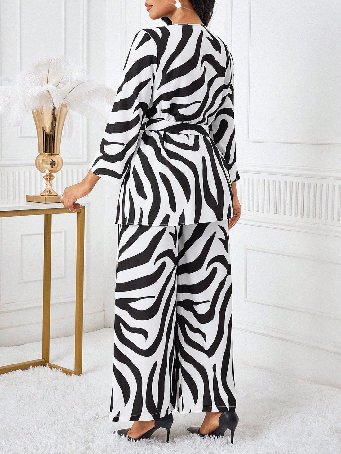 Make a bold statement with this eye-catching zebra print 2-piece set! Featuring a relaxed-fit top paired with comfortable matching pants, this dynamic duo brings instant personality to your everyday wardrobe. The striking black-and-white pattern works effortlessly for casual outings, weekend hangouts, or whenever you want to add a touch of wild style. Mix, match, or wear together—this versatile set gives you endless outfit possibilities with minimal effort. Perfect for fashion lovers who refuse to blend in!