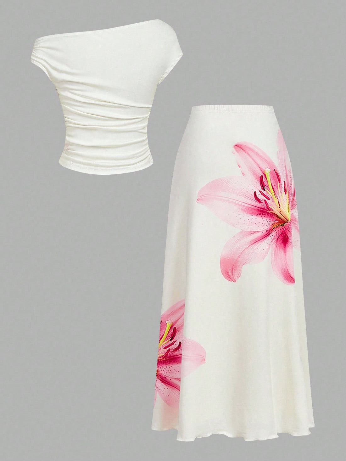 Bloom into elegance with this charming two-piece set! The ruched shoulder blouse features a delicate floral print that dances across soft fabric, while the flowing midi skirt creates a graceful silhouette perfect for summer gatherings and special moments. The thoughtful ruching adds dimension and flatters your frame, making this set your go-to choice for brunches, garden parties, or any occasion calling for effortless sophistication. Mix, match, or wear together—this versatile duo brings joy and style to yo