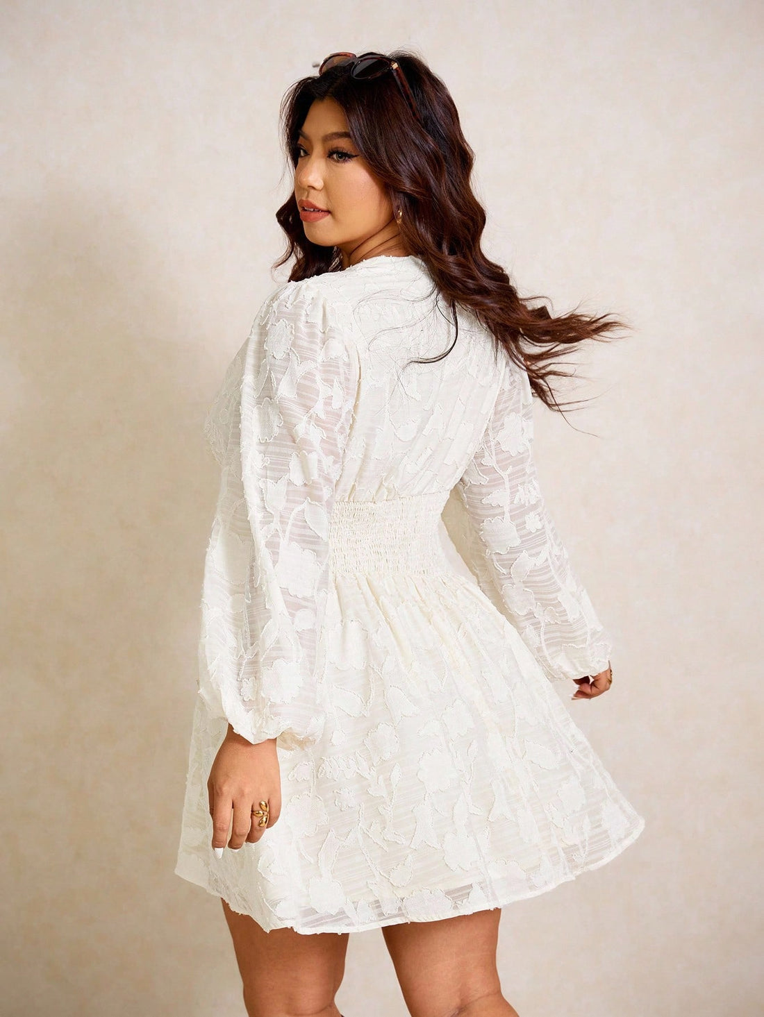 Make a bold statement in this plus-size dress that celebrates curves with style. The charming ruffle tie neck adds a flirty touch, while voluminous lantern sleeves bring drama and movement to every gesture. A cinched waist creates a flattering silhouette that defines your figure beautifully. Perfect for turning heads at brunches, date nights, or whenever you want to feel fabulous and fashion-forward. This dress proves that comfort and confidence go hand in hand.