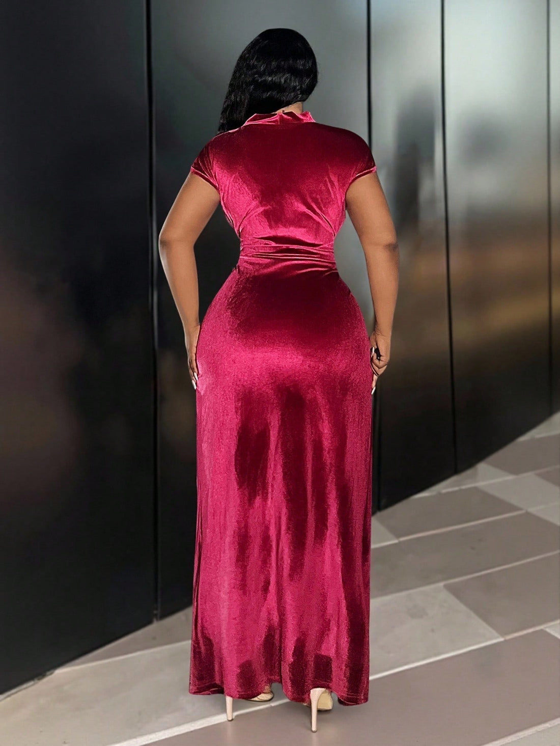 Turn heads in this Elegant Burgundy Velvet Maxi Dress, perfect for formal occasions. With its sleeveless V-neck design and daring slit hem, it combines sophistication with a hint of fun. The metal buckle detail adds a playful twist, making every step feel like a grand entrance. Feel confident and chic all night long!
