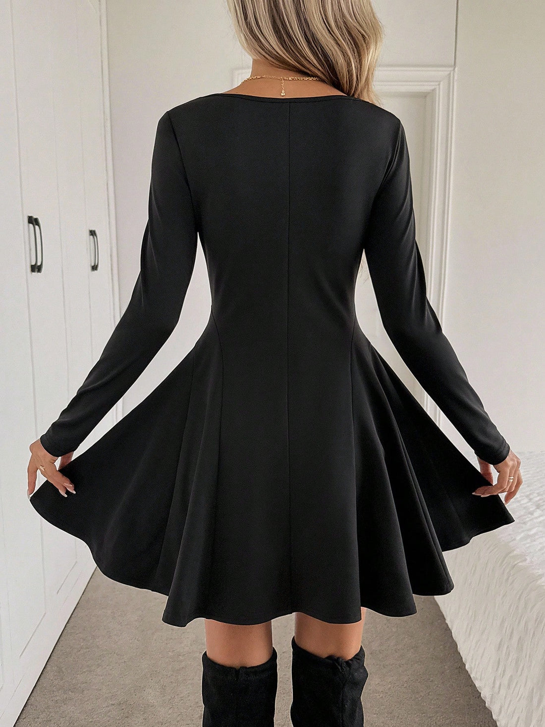 Elevate your fall wardrobe with this effortlessly chic black mini dress that's ready for anything. The long sleeves keep you cozy while the sleek silhouette flatters every frame. Whether you're heading to brunch, a night out, or just making a statement around town, this versatile piece transitions seamlessly from day to night. Pair it with sneakers for casual vibes or dress it up with heels—either way, you're serving looks. A timeless essential that proves black never goes out of style.