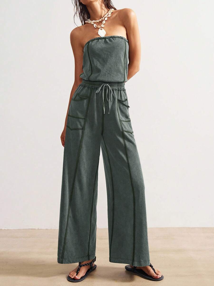 Front view of dark slate green strapless wide-leg jumpsuit with utility patch pockets