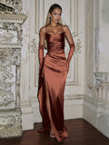 Copper-brown satin gown front view with fitted bodice, side drape and long slit