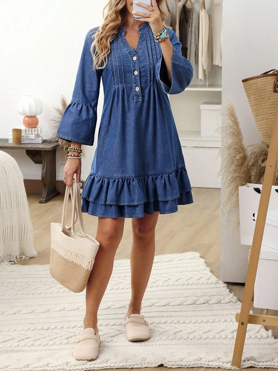 Full-body view of washed denim mini dress styled with woven tote and slip-on shoes