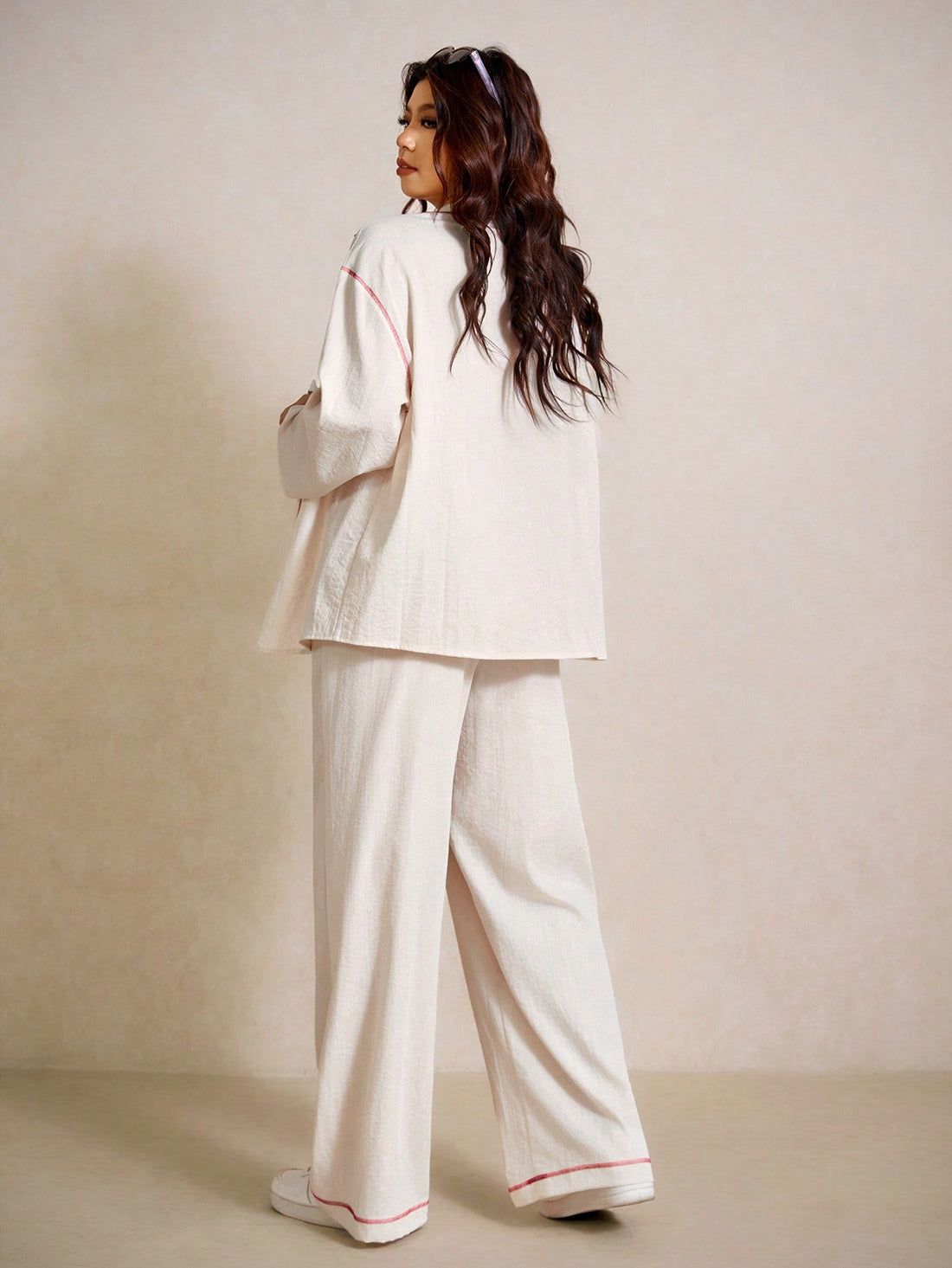 Elevate your casual wardrobe with this chic two-piece set designed for comfort and style! The cuffed sleeve shirt features practical front pockets, perfect for keeping your essentials close while looking put-together. Pair it with the matching pants for an instantly coordinated look that works from brunch to errands. Crafted with plus-size fit in mind, this set celebrates your curves with flattering proportions and quality construction. Whether you're dressing down for the weekend or keeping it relaxed on a