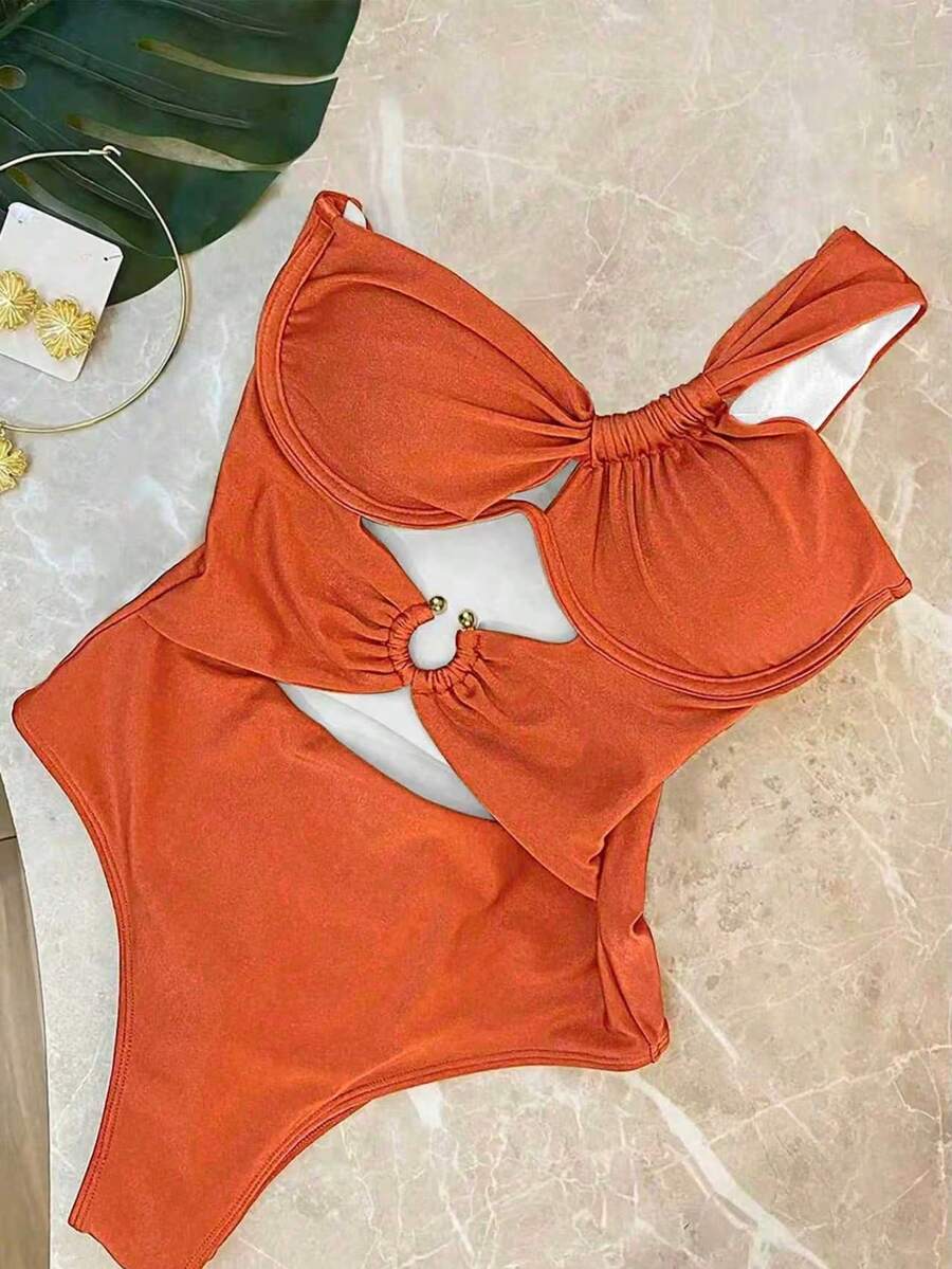 Make a statement this season in our stunning deep orange one-shoulder swimsuit. The asymmetrical neckline creates an effortlessly chic silhouette that flatters every figure, while the rich, warm tone complements all skin tones beautifully. Crafted from premium, quick-drying fabric with excellent stretch and recovery, this piece moves with you from poolside to beachside. The supportive fit and elegant design transition seamlessly from vacation days to evening gatherings. 