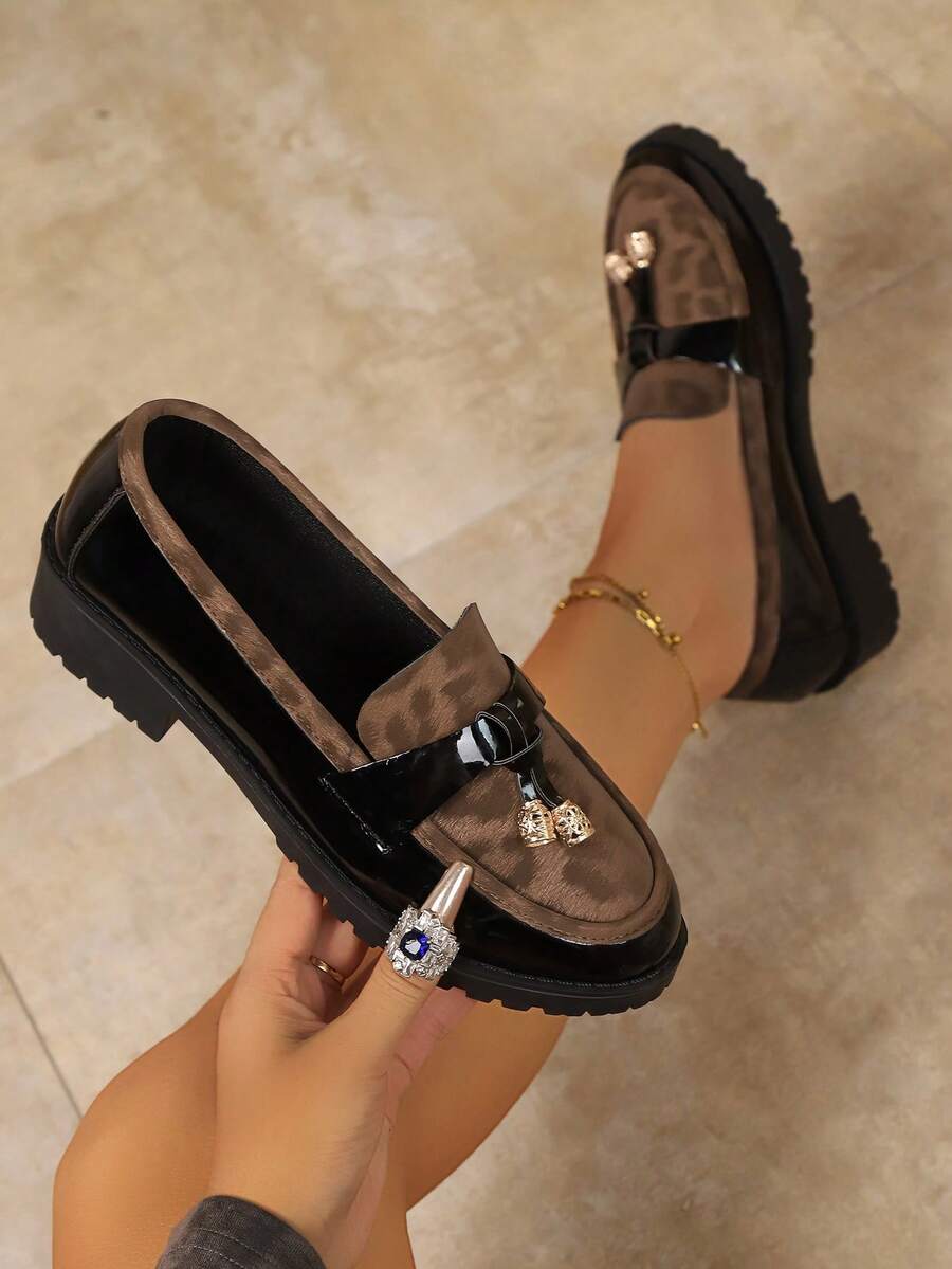 Step into effortless style with these vintage leopard print platform loafers, featuring eye-catching rhinestone tassels and a polished British aesthetic. The slip-on design offers convenient all-day comfort, while the flat platform sole provides stability without sacrificing sophistication. Crafted from durable PU leather with a PVC outsole, these preppy loafers transition seamlessly from office to casual occasions. Perfect for adding a bold, vintage-inspired touch to your everyday wardrobe.