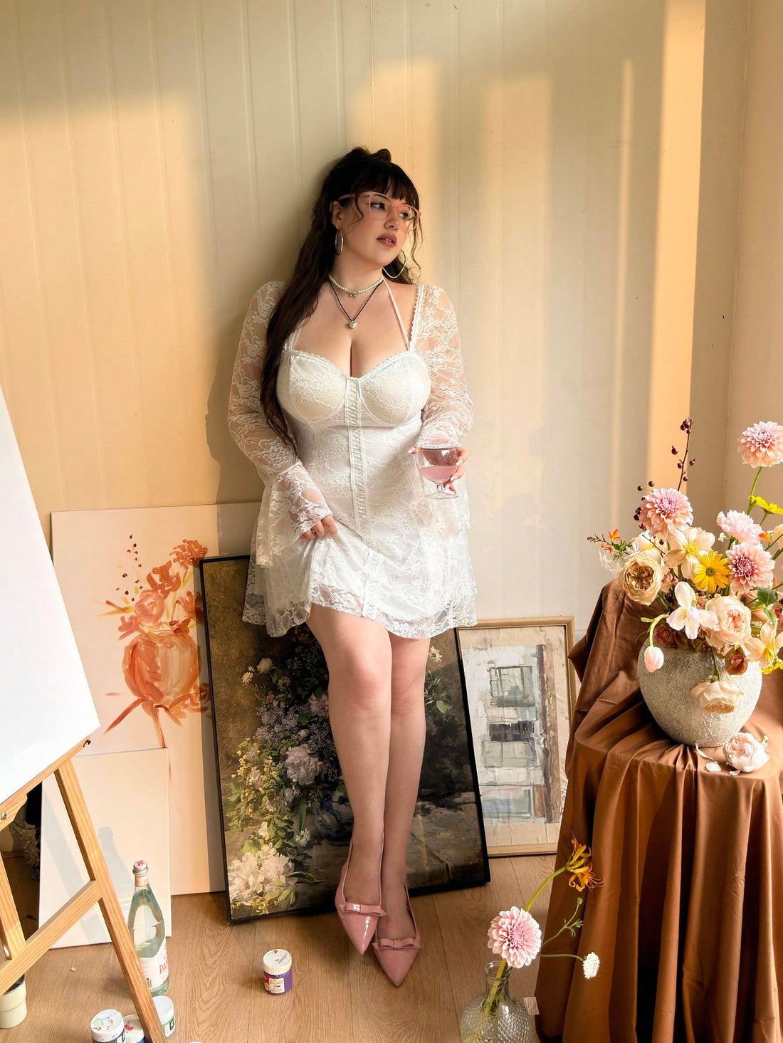 Step into charm with this chic plus size white lace dress, designed to highlight your curves with a flattering waist cinch. Long sleeves add a touch of elegance while keeping things playful and graceful. Perfect for making every occasion effortlessly stylish and delightfully comfortable.