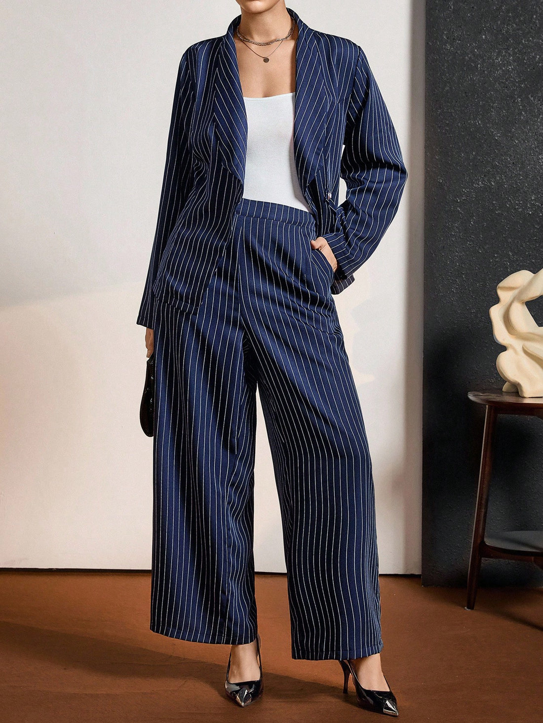 Elevate your work wardrobe with this stunning plus-size blazer set that's equal parts polished and fun! The crisp blue and white stripes bring timeless sophistication while the tailored fit flatters your frame beautifully. Perfect for boardroom meetings, client lunches, or anywhere you want to command attention, this set transitions seamlessly from fall into winter. Mix and match the pieces for endless styling possibilities—dress it up with heels or keep it casual with your favorite sneakers. Because lookin