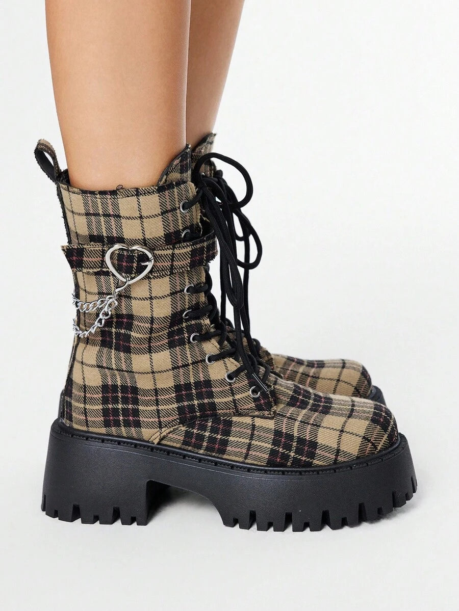 Stomp into the room with attitude in these badass lace-up motorcycle boots. Featuring a chunky heel and gothic platform sole, they're built for rebels who refuse to blend in. The edgy ankle silhouette pairs perfectly with everything from ripped jeans to leather jackets, giving you that effortlessly cool grunge vibe. Whether you're hitting the streets or making a statement, these boots deliver serious style with an uncompromising edge. Own your look.