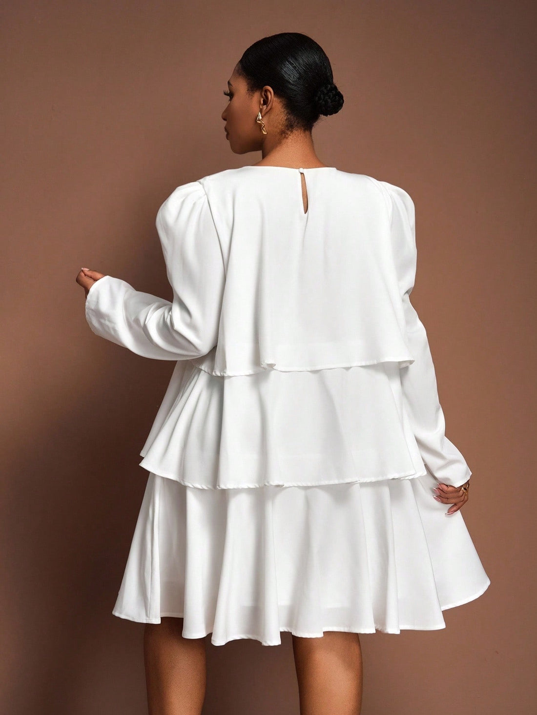 Step out in style with this Elegant Ruffle Hem A-Line Mini Dress designed especially for plus sizes. Its playful ruffle hem adds a flirty twist, while the flattering A-line cut ensures comfort and confidence. Perfect for spring and autumn days or any special occasion where you want to shine with ease and charm.