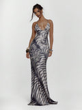 Front view of zebra print lace-up maxi dress with deep V neckline