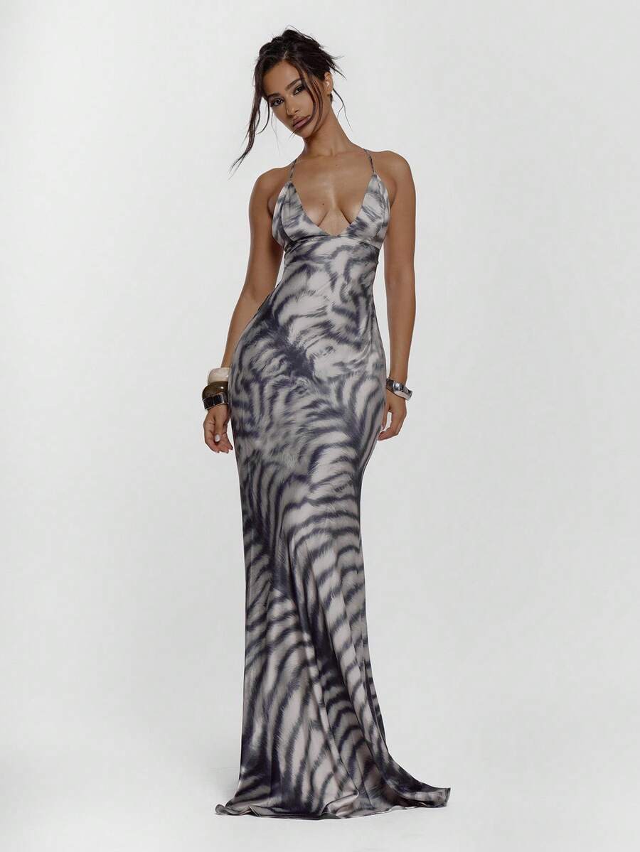Front view of zebra print lace-up maxi dress with deep V neckline
