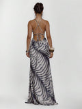 Rear view of zebra print sleeveless maxi dress with open crisscross back