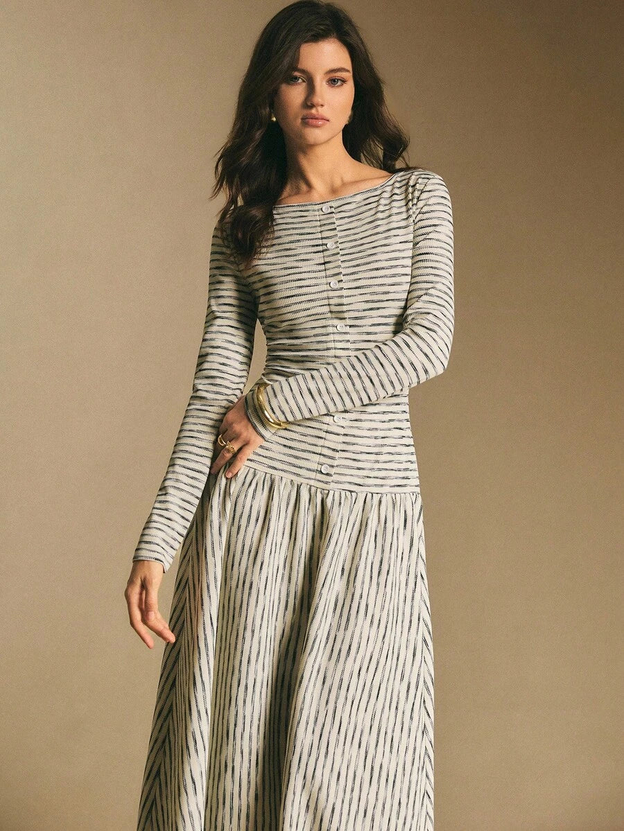 Close front view of the striped maxi dress showing round neckline, button placket, and long sleeves
