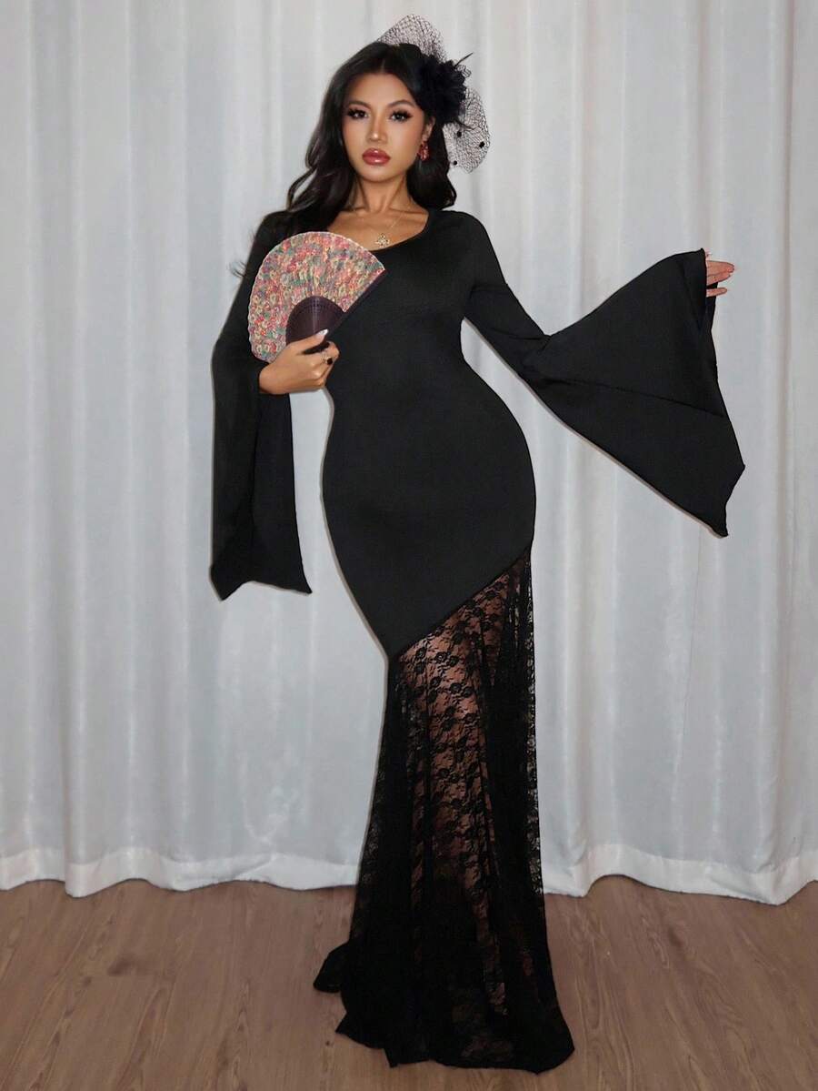 Front angled view of black mermaid maxi dress with sheer floral lace lower skirt