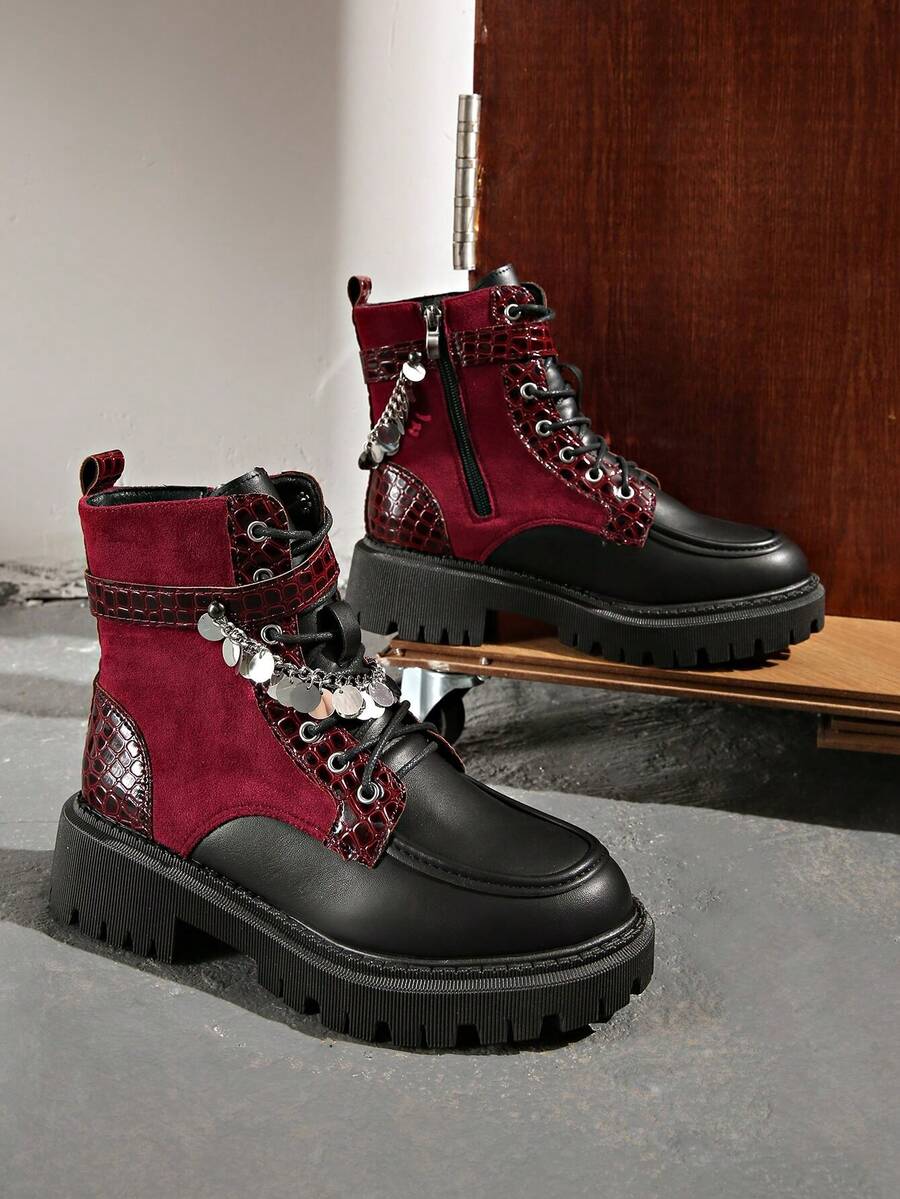 Step into bold style with these Chic Colorblock Punk Ankle Boots, where edgy meets elegant. Featuring striking colorblock design and industrial metal eyelets, these boots command attention from every angle. The convenient side zipper makes them easy to slip on, while the punk-inspired aesthetic adds attitude to any outfit. Perfect for those who refuse to blend in, these ankle boots deliver attitude and comfort in one fierce package. Make a statement that's unmistakably you.