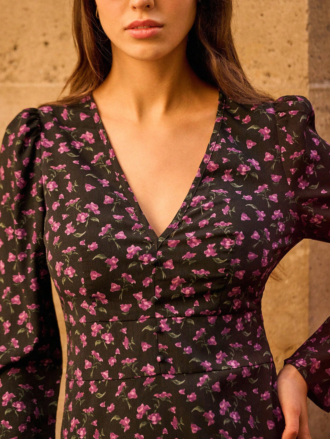 Bloom into autumn with this stunning floral midi dress that's equal parts sophisticated and fun. The deep V-neckline adds a touch of allure while the flowing long sleeves keep you cozy as temperatures drop. Perfect for brunch dates, casual outings, or those moments when you want to look effortlessly put-together without trying too hard. The midi length hits just right, giving you that sweet spot between playful and polished. Whether you're pairing it with sneakers for a laid-back vibe or dressing it up with