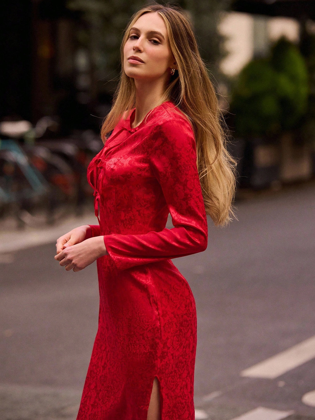 Elevate your seasonal wardrobe with this stunning floral jacquard midi dress—a playful twist on timeless elegance. The intricate jacquard weave brings texture and visual interest, while the charming triple tie detail at the waist adds a whimsical touch that flatters your silhouette. Perfect for fall and winter gatherings, from casual brunches to festive celebrations, this midi-length beauty strikes the ideal balance between sophisticated and fun. The rich floral patterns work beautifully with cooler-weather