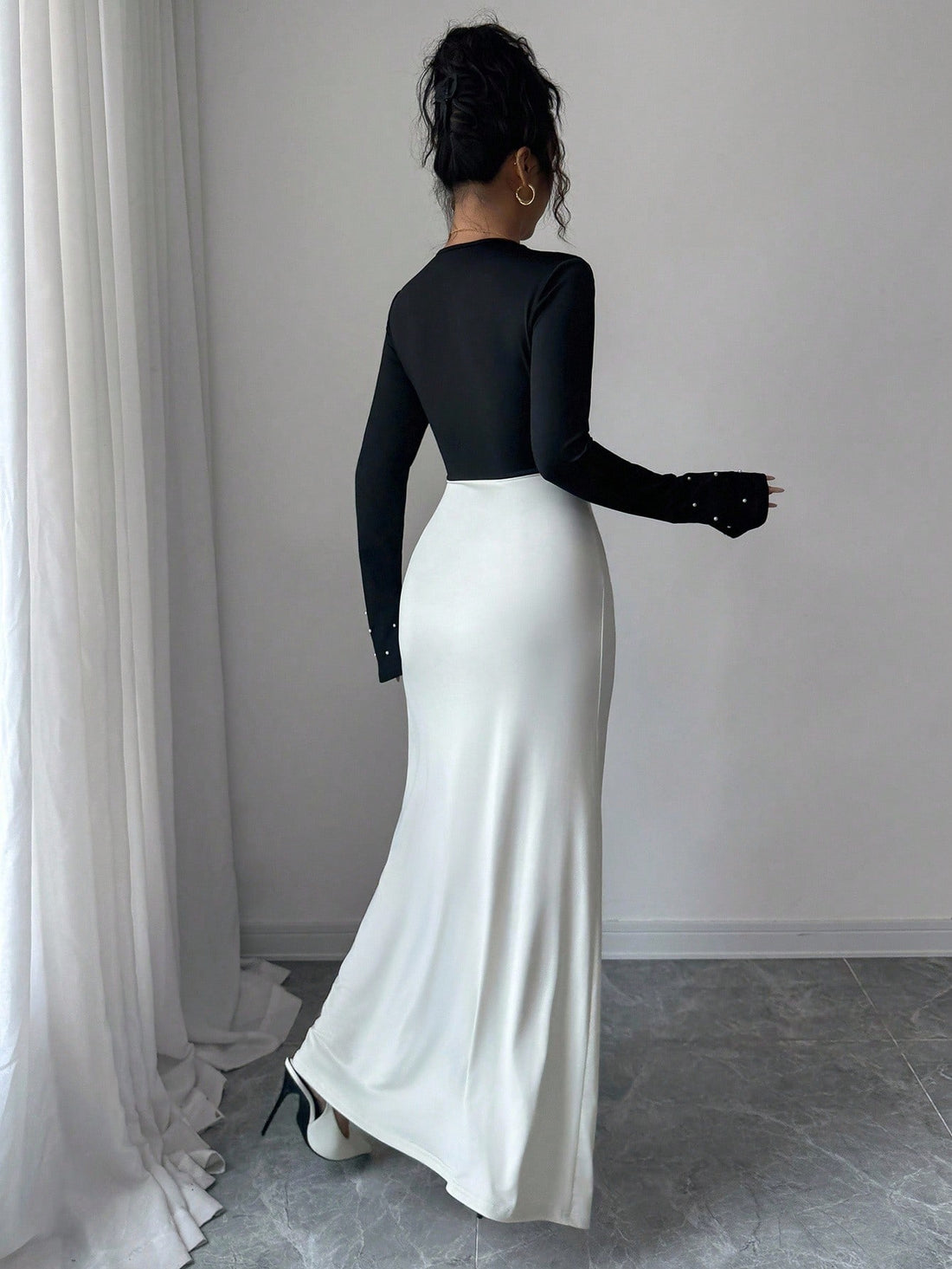 Slip into sophistication with this stunning pearl-adorned bodycon dress that's ready to turn heads at any celebration. The high-waist silhouette flatters your figure while pleated maxi detailing adds graceful movement and dimension. Perfect for formal galas, birthday bashes, and those moments when you want to feel absolutely fabulous. The delicate pearl embellishments catch the light beautifully, giving you that extra sparkle without trying too hard. Whether you're dancing the night away or making a grand e