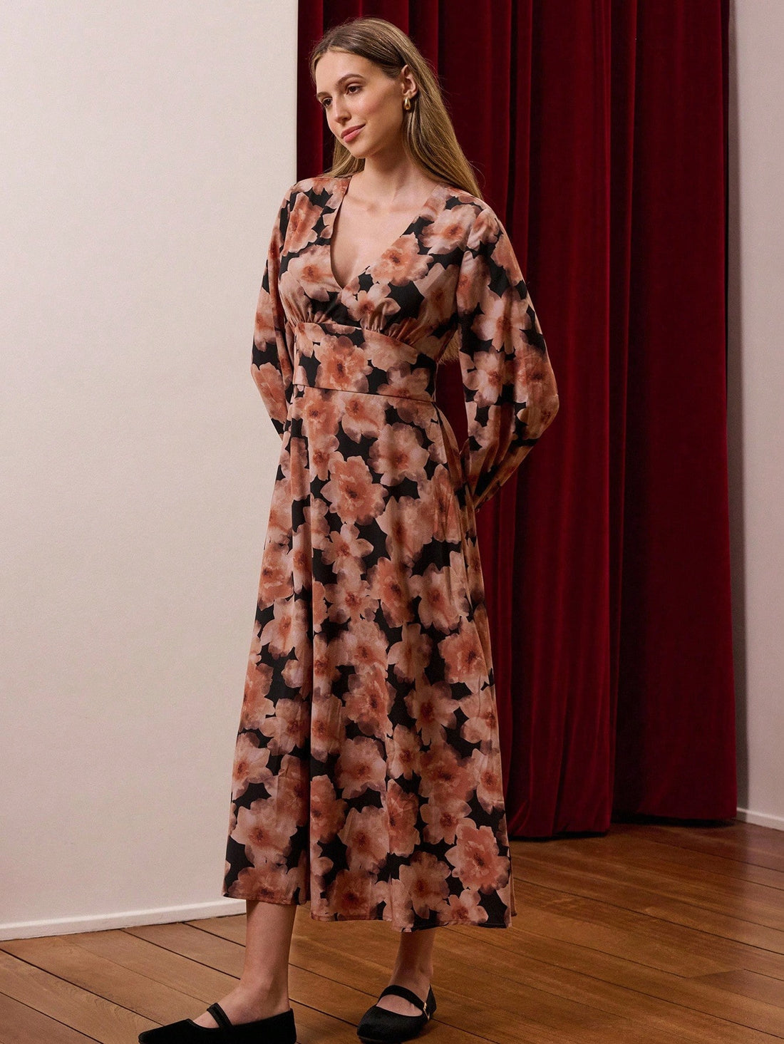 Elevate your autumn wardrobe with this stunning floral print maxi dress that effortlessly blends sophistication with seasonal charm. The flattering deep V-neckline and flowing long sleeves create an elegant silhouette perfect for business casual settings or weekend gatherings. Rich botanical patterns bring visual interest while the maxi length offers graceful movement and versatile styling options. Whether you're heading to the office or out for an evening, this dress transitions seamlessly from day to nigh