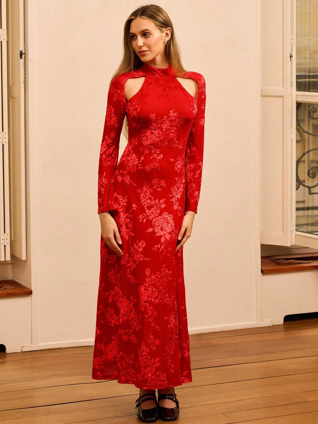 Make a statement at your next celebration in this stunning red floral burnout maxi dress. The high neckline and daring cut-out shoulders create an effortlessly chic silhouette that balances elegance with modern edge. The flowing maxi length moves beautifully with every step, while the intricate floral burnout detailing adds texture and visual interest. Perfect for weddings, galas, or any festive gathering where you want to turn heads and feel absolutely fabulous. This dress proves that sophisticated style d
