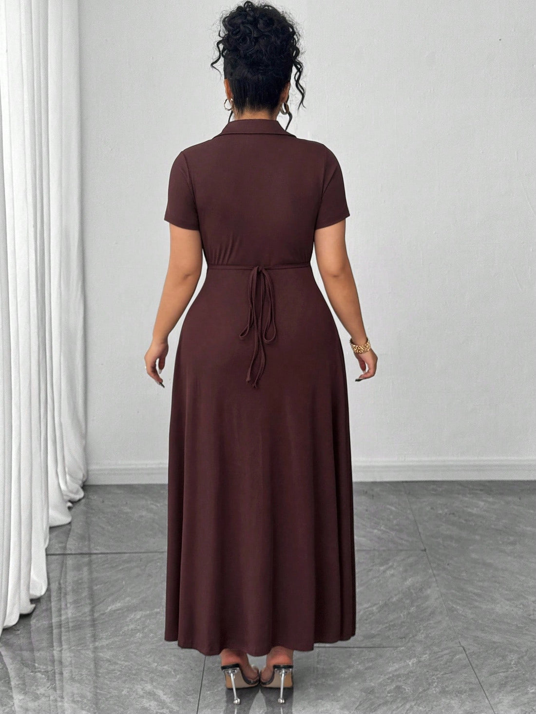 Elevate your everyday wardrobe with this chic brown knit dress that's as practical as it is polished. The classic polo collar adds a touch of preppy charm, while the cinched waist creates a flattering silhouette that celebrates your curves. Crafted from soft, comfortable knit fabric, it's the ultimate commuter essential—dress it up with heels for the office or keep it casual with sneakers for weekend errands. Versatile, comfortable, and undeniably stylish, this dress proves that looking put-together doesn't