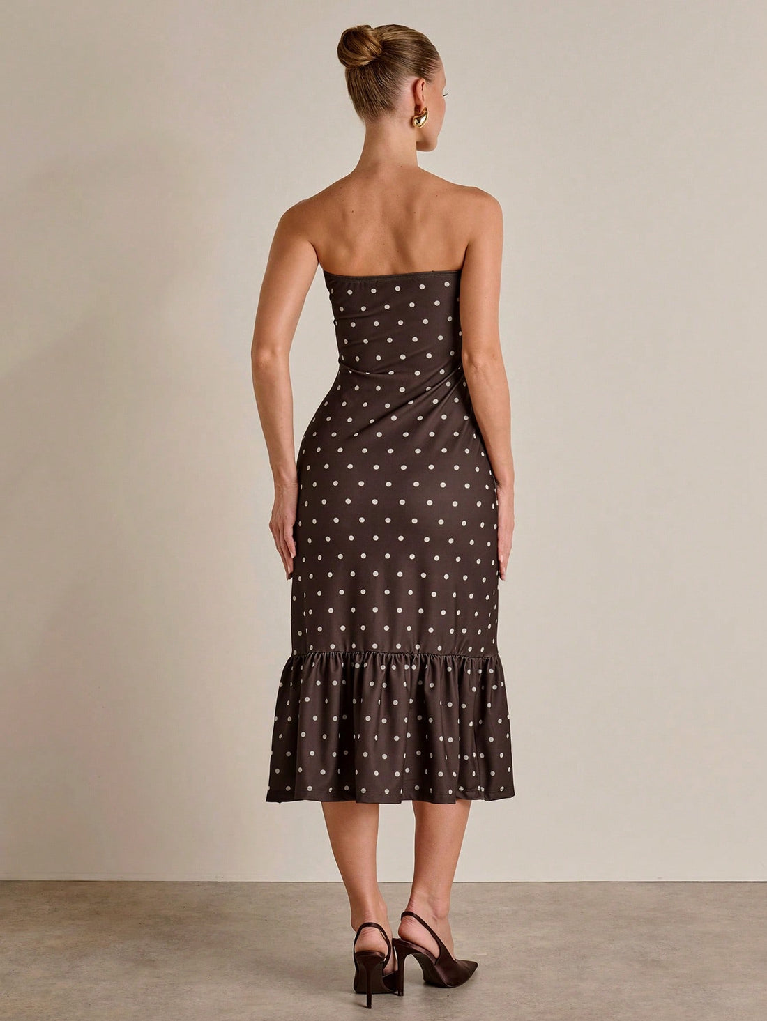 Twirl into sophistication with this charming polka dot dress that's equal parts fun and fabulous. The fitted silhouette hugs your curves in all the right ways, while the dramatic fishtail hem adds a flirty flourish that turns heads. Perfect for date nights, brunch dates, or whenever you want to feel like the best-dressed person in the room. This playful piece proves that timeless polka dots never go out of style—they just get better with a modern twist.