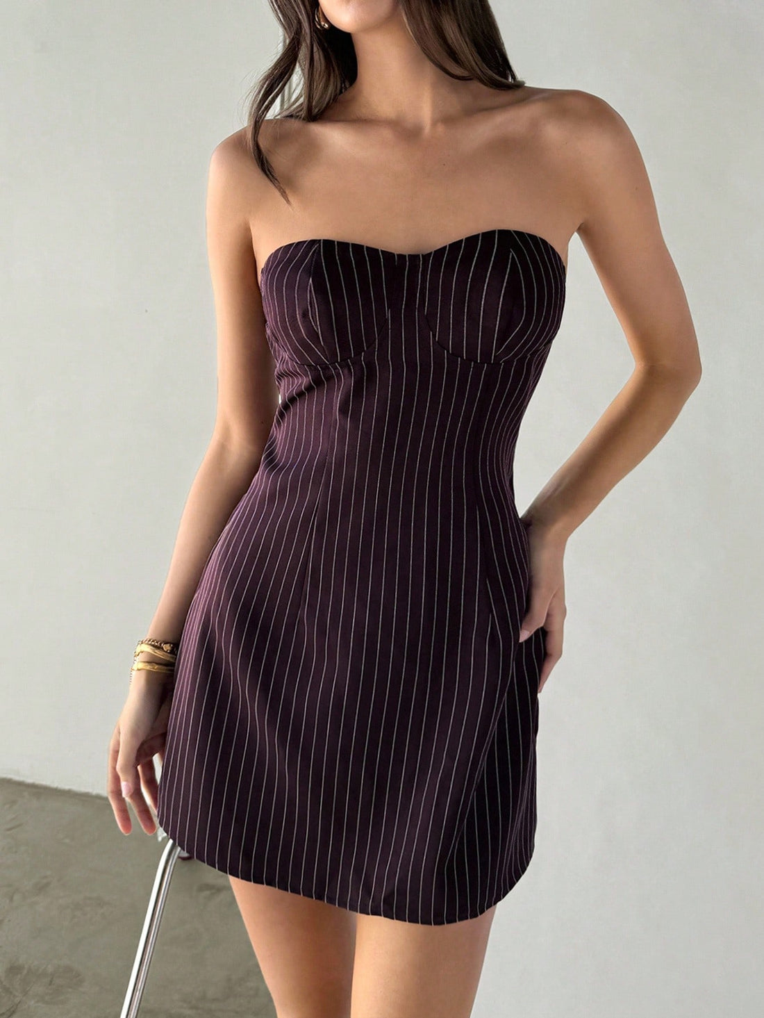 Stripes never go out of style—especially when they're this chic! This deep brown bustier mini dress is your new go-to for those crisp autumn and cozy winter days. The structured bustier top keeps you feeling confident and put-together, while the playful striped pattern adds just the right amount of personality. Pair it with tights and boots for an effortless look that works from brunch to evening plans. Simple, stylish, and ready for anything.