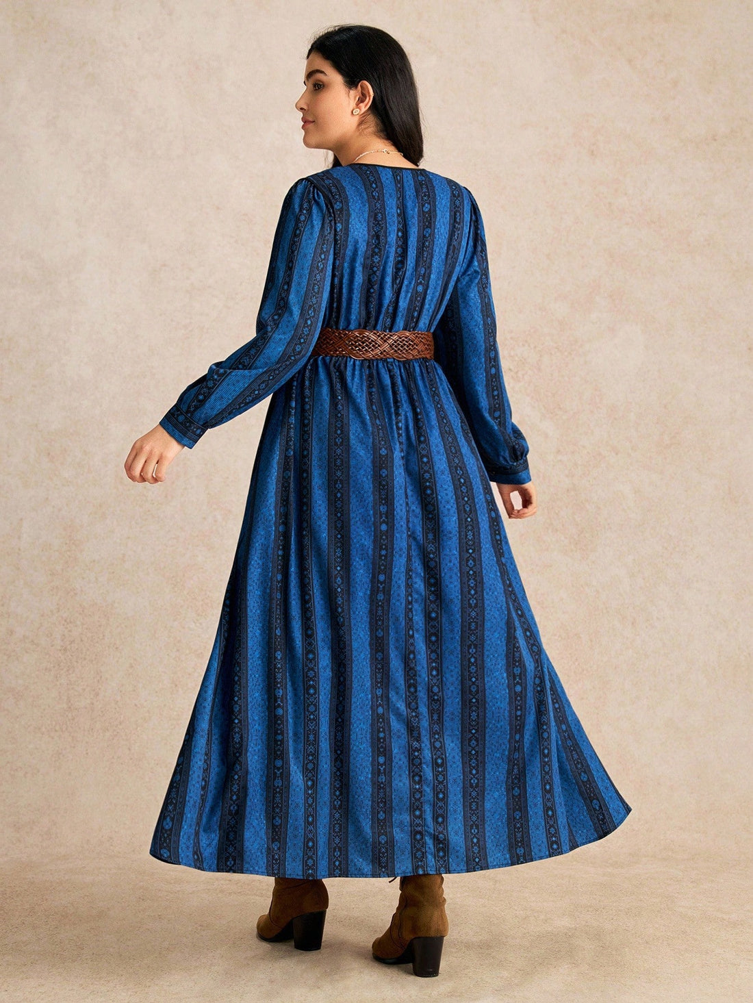 Make a statement in this stunning plus-size maxi dress that effortlessly blends sophistication with fun. The asymmetrical cut and mixed striped-floral pattern create visual intrigue, while the flowing silhouette flatters and moves beautifully. Perfect for date nights, celebrations, or any occasion where you want to feel confident and fabulous. Dress it up with heels and jewelry, or keep it casual—this versatile piece adapts to your vibe and makes sure all eyes are on you.