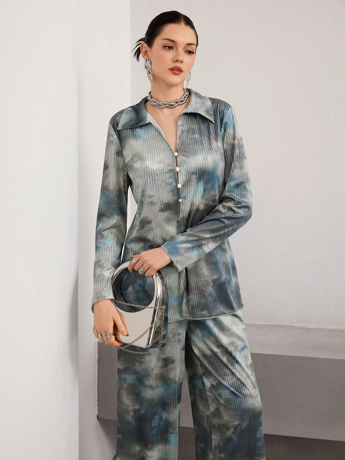 Make a statement with this vibrant tie-dye two-piece set that effortlessly blends comfort and style. The relaxed-fit top pairs perfectly with matching pants, creating a coordinated look that's ready for anything—from casual commutes to weekend hangouts. Soft, breathable fabric keeps you feeling great all day long, while the eye-catching tie-dye pattern adds that perfect pop of personality to your wardrobe. Mix, match, or wear together for instant, fuss-free fashion that lets your vibe shine through.