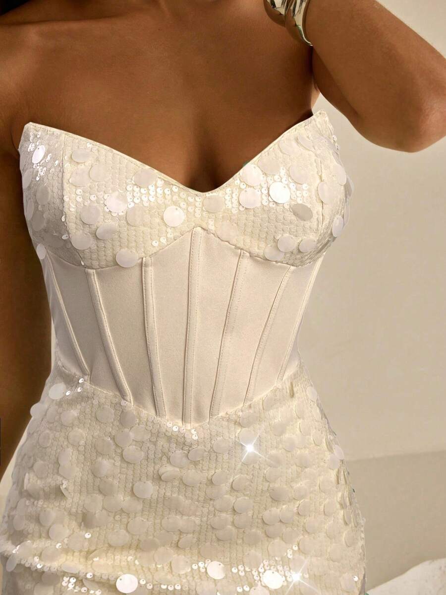 Ivory corset-style mini dress with shimmering sequin texture