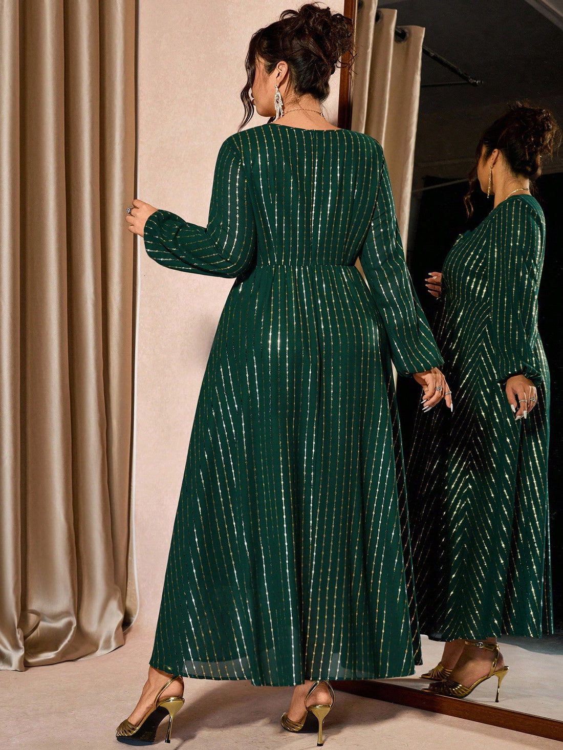 Step into the spotlight this holiday season in a dress that's as fabulous as you are! This elegant plus-size party dress features a classic crew neckline and long sleeves for timeless sophistication, while a shimmering foil hem adds that show-stopping sparkle perfect for Christmas celebrations. The flattering silhouette is designed to make you feel confident and radiant all night long. Whether you're dancing at a festive gathering or toasting to the season, this luxe piece transforms any occasion into a gla