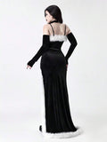 Back view of black gothic velvet maxi dress with spaghetti straps and faux fur trim
