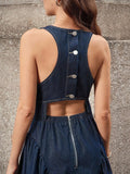Close rear view of dark-indigo denim dress with metal buttons horizontal cutout and exposed zipper
