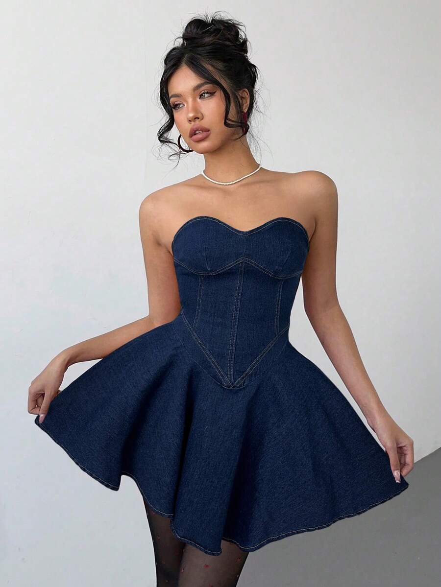 Embrace effortless summer style with this boho strapless sweetheart denim mini dress. The flattering A-line silhouette skims the body while the strapless design offers a chic, shoulder-baring look perfect for resort getaways and warm-weather adventures. Crafted from classic denim, it pairs beautifully with sandals, a lightweight shawl, or layered jewelry for an easy, breezy aesthetic. Ideal for beach days, casual outings, or vacation-ready moments when you want to feel relaxed and put-together.