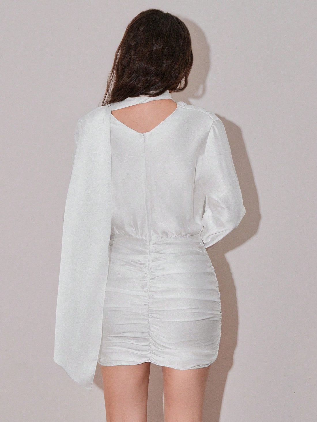 Elevate your everyday style with this chic mini dress that's equal parts sophisticated and fun. Featuring a flattering ruched neckline and long sleeves for versatile coverage, this piece transitions seamlessly from day to night. The pleated design adds movement and dimension, while the solid color keeps things timeless. Perfect for date nights, casual outings, or whenever you want to feel effortlessly put-together. Dress it up with heels or keep it relaxed with sneakers—this wardrobe essential does it all.