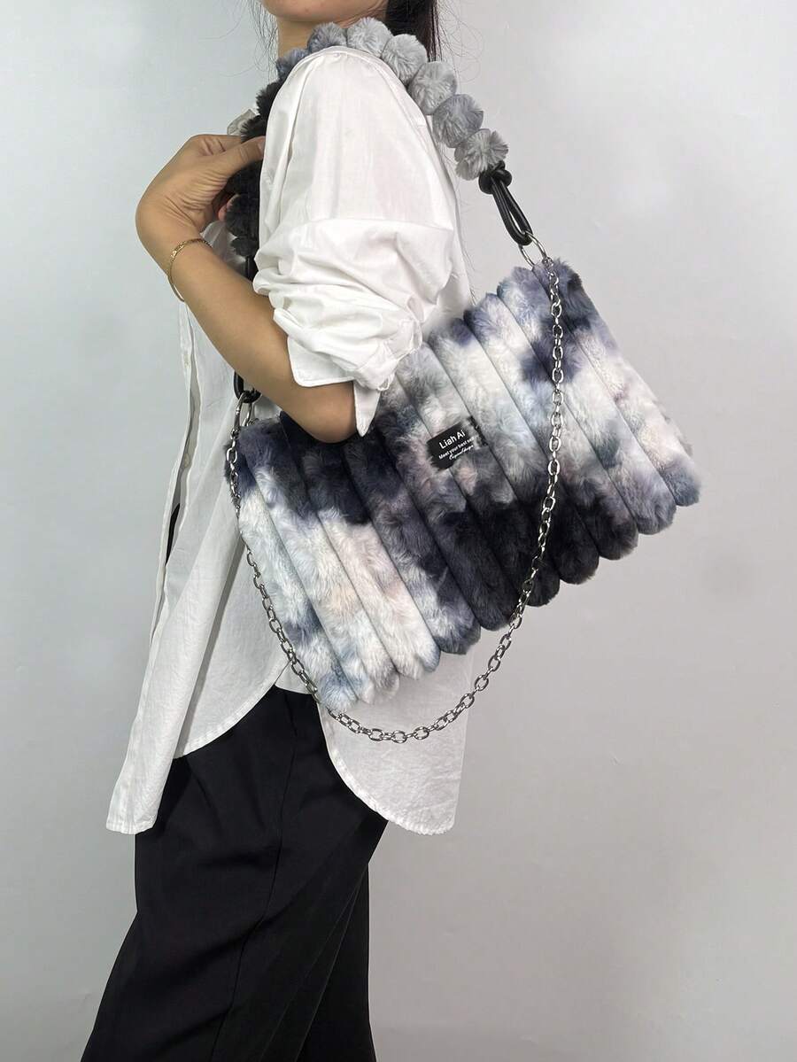 Elevate your winter wardrobe with this sumptuous rabbit fur tote—the ultimate blend of cozy luxury and everyday practicality. Crafted from plush, touchable fur in a range of chic colors, this spacious bag keeps your essentials organized while making a statement. The detachable strap lets you switch between shoulder carry and hand-held styling, adapting to your mood and outfit. Perfect for autumn strolls, holiday shopping, or those moments when you want to feel absolutely fabulous. Soft, sophisticated, and u