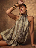 Front view of tan snakeskin-print halter mini dress with layered ruffle hem