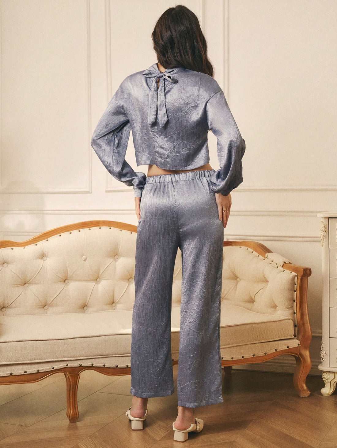 Indulge in the luxurious feel of our Elegant French Vintage Satin 2-Piece Set for Women. This set is perfect for the fashion-forward woman who wants to make a statement this Autumn/Winter. With its vintage-inspired design and satin fabric, you'll feel elegant and stylish without sacrificing comfort.