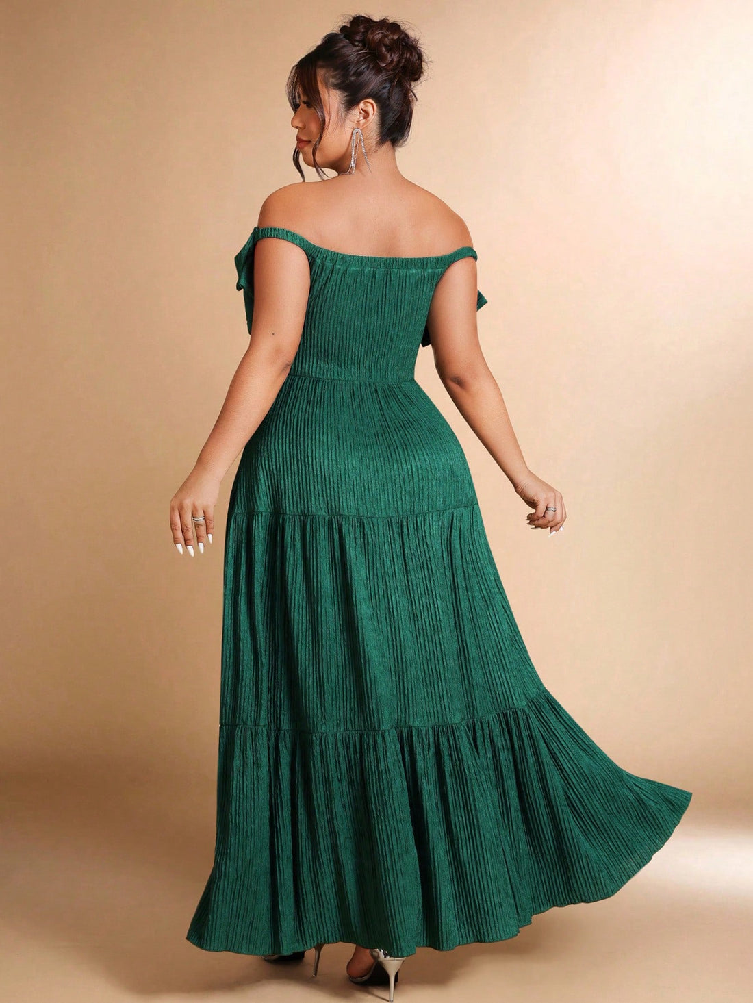 Make a statement this holiday season in this stunning plus-size dress that effortlessly blends sophistication with festive flair. The charming off-shoulder neckline frames your shoulders beautifully, while the playful bow detail adds a touch of whimsy. Unique patchwork elements create visual interest and movement, ensuring you'll turn heads at every Christmas party. Designed for curves and comfort, this dress celebrates your style with confidence and elegance. Perfect for creating unforgettable holiday memo