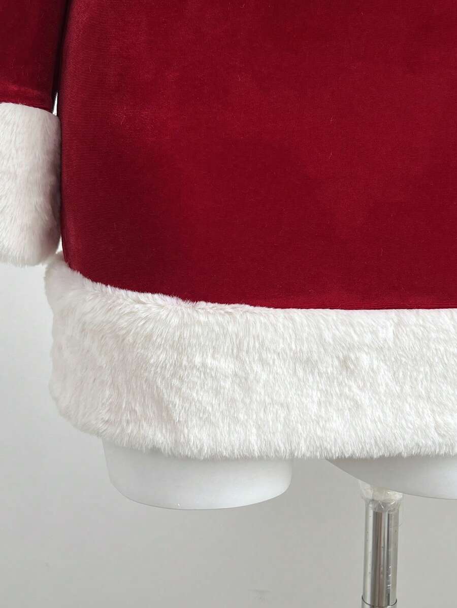 Close view of white faux fur hem trim on red Christmas mini dress