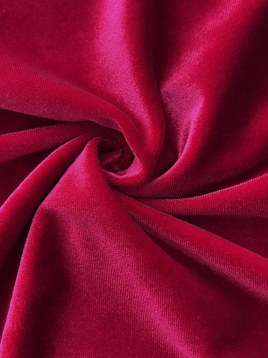Close view of soft red knitted fabric on festive bodycon mini dress