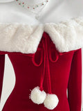 Close view of white faux fur collar and red pom-pom tie detail